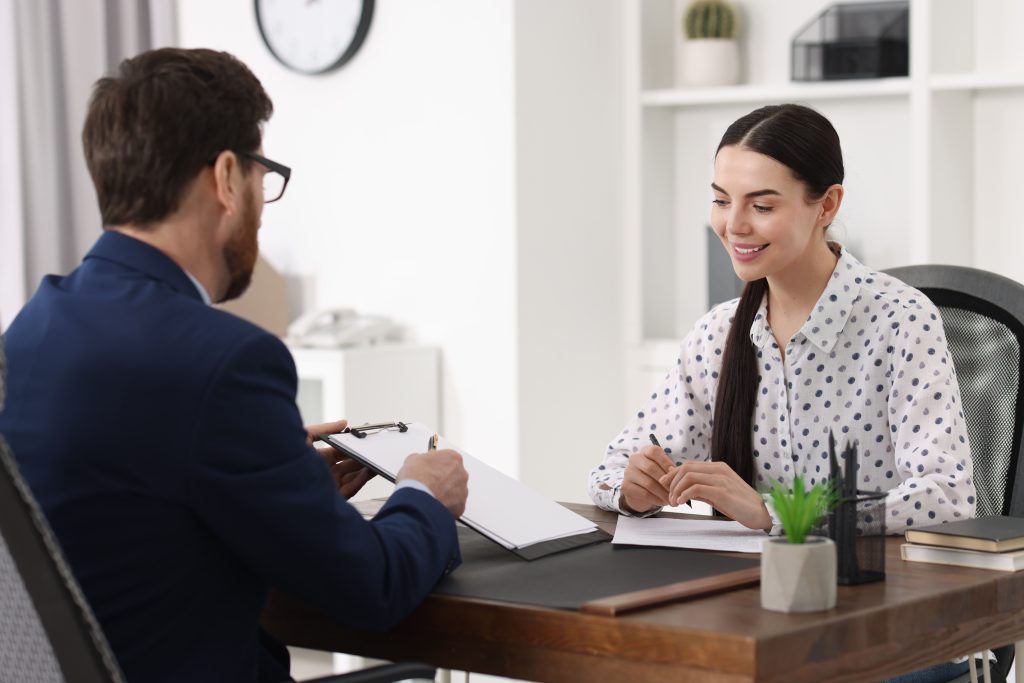 Young,Woman,Having,Meeting,With,Lawyer,In,Office
